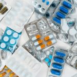 a pile of pills sitting next to each other on top of a table